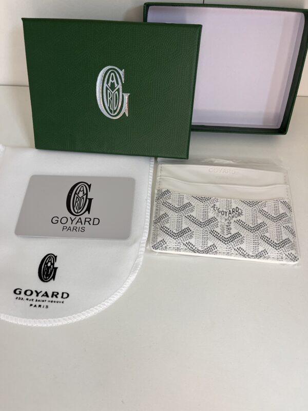 porte casrte blanc goyard